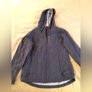 Grey lightweight rain coat. Size small. Excellent condition.
